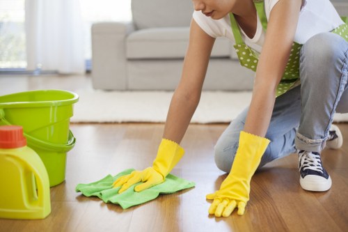 Carpet cleaning technician treating stains in a commercial property